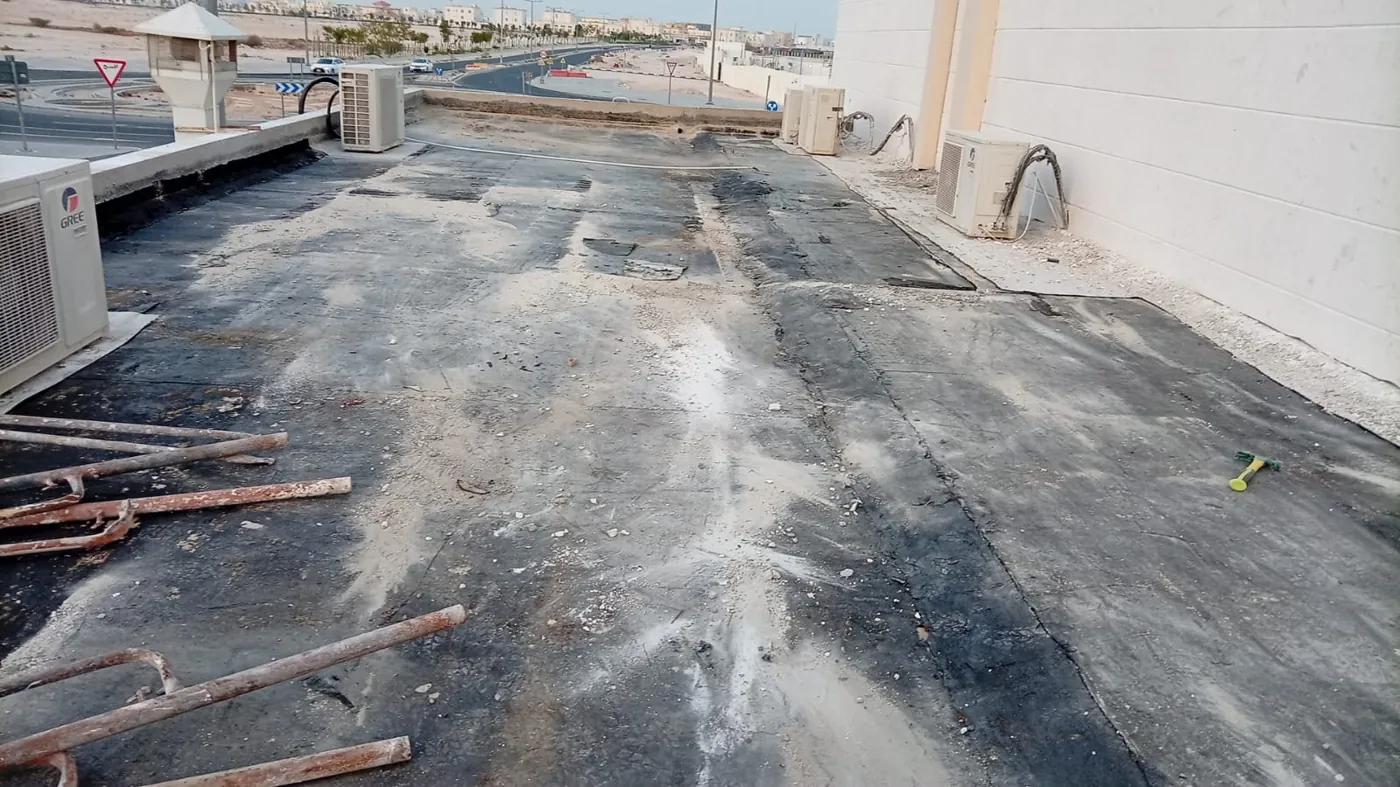 Existing roof: Condition survey of an ageing bitumen membrane before re-waterproofing.
